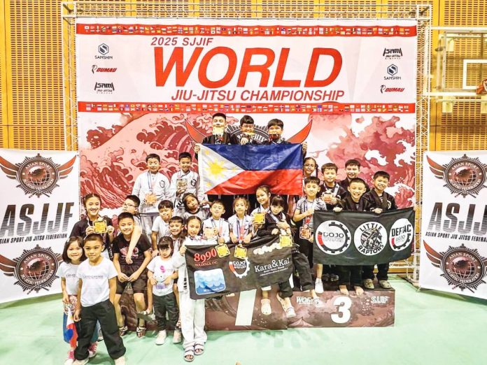 DEFTAC Six Blades Jiu-jitsu kids pose for a group photo after winning the overall championships in Chiba, Japan recently. CONTRIBUTED PHOTO