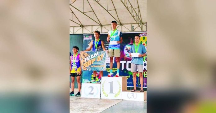 sports Magbanua_superimposed Randolf Magbanua clocked an impressive 2:33:33 to capture the men’s crown in the North Negros Marathon. CONTRIBUTED PHOTO