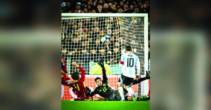 Lionel Messi chipped the ball over the goalkeeper and two defenders to give Argentina a 1-0 advantage against Venezuela. Photo courtesy of Bleacher Report Football.