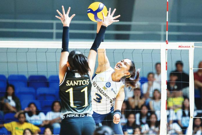 sports NUNS copy Negrense Diza Berayo of National University-Nazareth School Lady Bullpups tries to score against Aneeza Santos of University of Santo Tomas Junior Golden Tigresses. UAAP PHOTO
