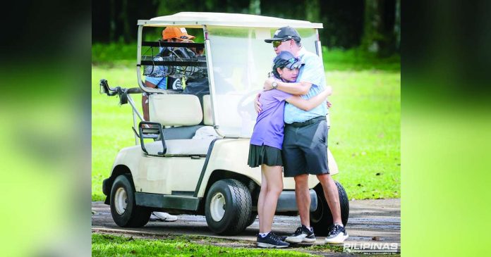 sports Youth_superimposed Tashanah Balangauan gets a warm embrace from her father, Baltaire, after pulling off a gutsy come-from-behind victory over Precious Zaragosa. ICTSI PHOTO