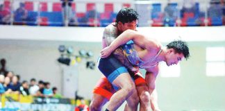 Gabe Dinette (red shirt) tries to wrestle Jason Baucas during WAP’s national youth championships at the Tagaytay Combat Sports Center. PHOTO COURTESY OF JEBE GONZALES
