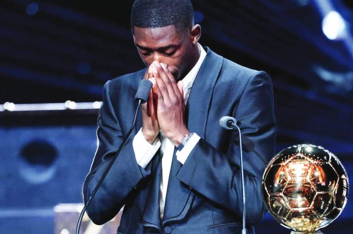 sports_PSG_copy_resized Paris Saint-Germain forward Ousmane Dembele turns emotional after receiving the Ballon d’Or award during the 2025 Ballon dOr France Football award ceremony at the Theatre du Chatelet in Paris. AFP