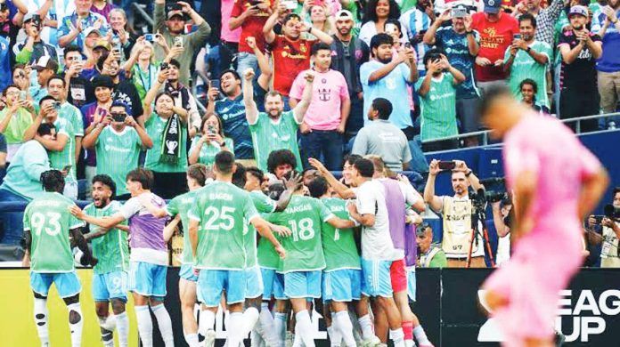 Seattle’s Alex Roldan celebrates with Sounders teammates after scoring the second goal in their 3-0 victory over Inter Miami in the Leagues Cup final. PHOTO COURTESY OF RICH LAM / GETTY IMAGES
