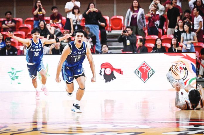 Ray Allen Torres rejoices after his game-winner for Adamson University Falcons. UAAP PHOTO