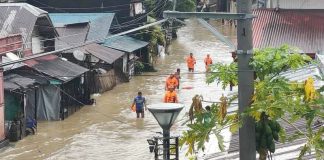 Personnel from the Buruanga Municipal Disaster Risk Reduction and Management Office monitor rainfall and river levels on October 27 as they stay on alert for possible renewed flooding following continuous rains in Aklan Province. MDRRMO BURUANGA PHOTO