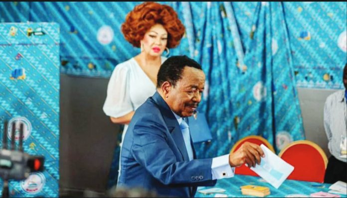 Cameroon Cameroon’s President Paul Biya, 92, posts his ballot as his wife Chantal, 54, watches on. He was later proclaimed the winner for a controversial eighth term. REUTERS