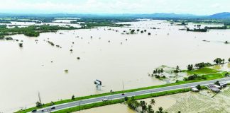 An aerial view, captured on Oct 19, shows damaged houses and flooded farmlands along the highway approaching the Municipality of Sigma, Capiz. CIVIL DEFENSE WV FB PHOTO