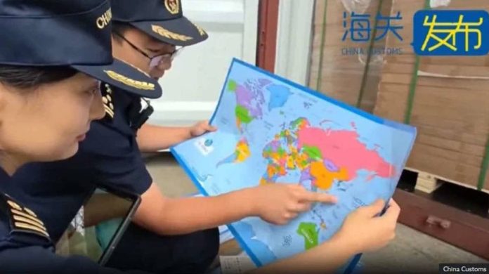 China.JPG_resized_compressed Two Chinese customs officers check an area near China on the map. Chinese Customs