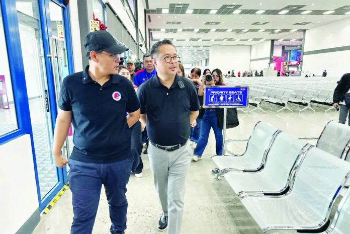 DOTr_shipping_lines_resized_compressed Department of Transportation Acting Secretary Giovanni Lopez (left) led the inspection at the Batangas Port to ensure its readiness for the expected influx of travelers on Undas (All Saints’ and All Souls’ days). DOTR PHOTO