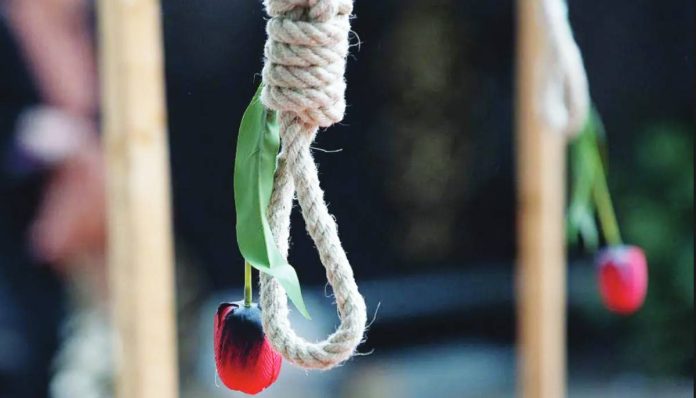A rose hangs from a noose displayed during a protest by exiled Iranian opposition group, the National Council of Resistance of Iran, and other Franco-Iranian groups in Paris, France. GETTY IMAGES
