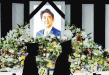 Man pleads guilty to killing Japan’s former PM Shinzo Abe Flower tributes are left outside Nippon Budokan Hall, where the state funeral for former Prime Minister Shinzo Abe was held, in Tokyo, Japan on September 27, 2022. REUTERS