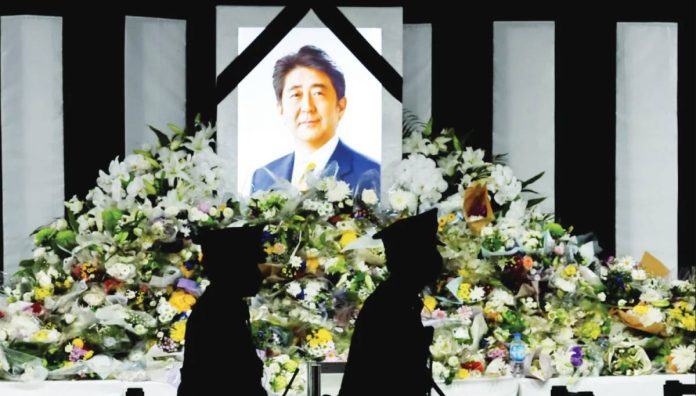 Japan Flower tributes are left outside Nippon Budokan Hall, where the state funeral for former Prime Minister Shinzo Abe was held, in Tokyo, Japan on September 27, 2022. REUTERS