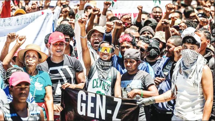 Madagascar Dozens of people march in the Madagascar capital of Antananarivo, with their fists in the air. AFP VIA GETTY IMAGES