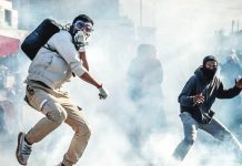 Army general named as Madagascar PM to quell Gen Z protests A protester wearing a gas mask jumps to avoid a teargas canister during clashes with Malagasy security forces. Protests in major cities across Madagascar have entered their third week. AFP VIA GETTY IMAGES