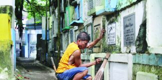Fifty-eight-year-old Fernando Bugna dedicates his 20 years cleaning and repainting graves at Tanza Cemetery in Iloilo City – a humble yet steady livelihood that has quietly sustained his family. AJ PALCULLO/PN