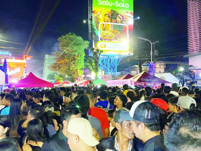 MassKara_generally_peaceful_copy_resized_compressed Scene at Lacson Tourism Strip on the final night of the 2025 MassKara Festival. CESAR JOLITO III/WDJ