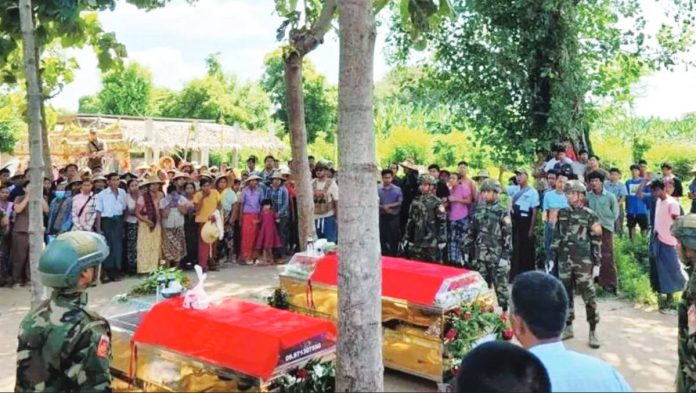 Myanmar_resized Villagers and soldiers attend the funeral of victims killed in an airstrike in Myanmar’s Sagaing region on Oct. 8, a day after a military paraglider dropped bombs on a crowd celebrating the Thadingyut Buddhist festival. At least 24 people were confirmed dead and 47 wounded in what rights groups condemned as part of the junta’s escalating air campaign against civilians. PDF