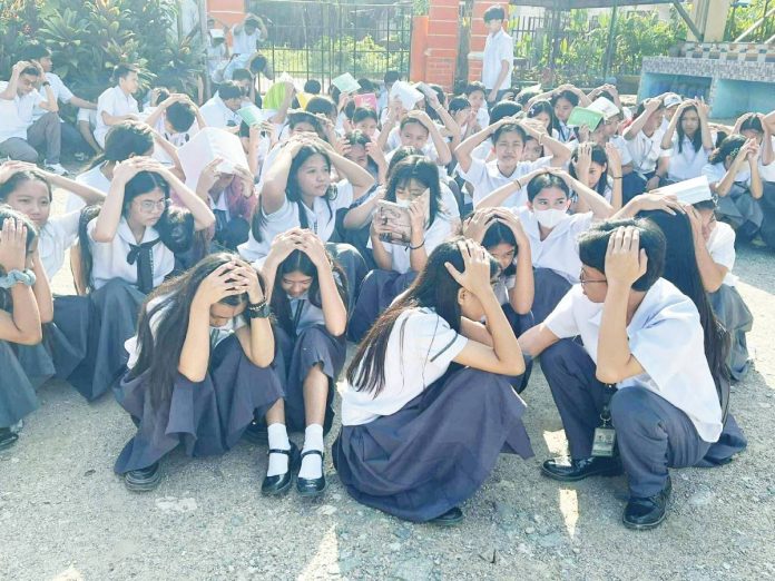 Students and teachers of Sipalay City National High School evacuated their classrooms following a magnitude 4.9 earthquake in Sipalay City, Negros Occidental on Oct. 7, 2025. SCNHS TEACHERS PHOTO