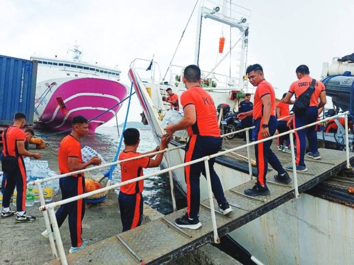 PCG-WV_aid_2_copy_resized Personnel of the Philippine Coast Guard District Western Visayas load relief goods onto the BRP Corregidor (AE-891) bound for Cebu following the magnitude 6.9 earthquake on September 30, 2025. The shipment includes drinking water, canned goods, clothes, and instant noodles to support affected communities. CIVIL RELATIONS GROUP-WV PHOTO