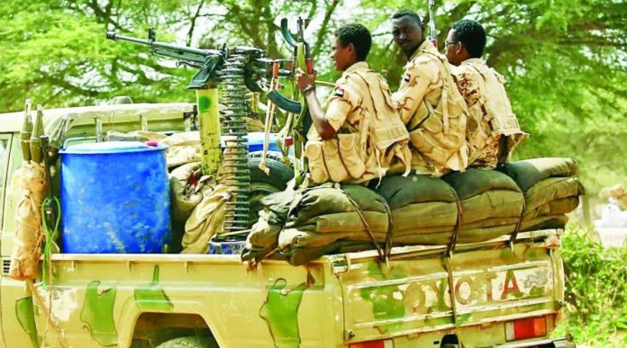 Sudan Three RSF fighters are seen on the back of an machine-gun armed Toyota pick-up truck in Darfur, Sudan. The RSF has its origins in the notorious Janjaweed militia accused of genocide and ethnic cleansing against the region's non-Arab population. AFP/GETTY IMAGES