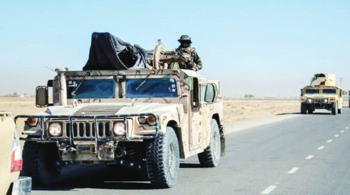 Taliban copy A man with his face covered stands atop a military vehicle patrolling Shorabak district near the Afghanistan-Pakistan border. AFP VIA GETTY IMAGES