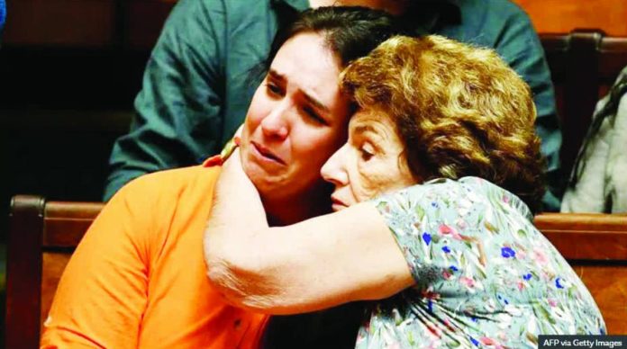 Uruguay copy_compressed Florencia Salgueiro (left), a leading advocate for assisted dying in Uruguay, is comforted as senators debate a euthanasia bill at the Legislative Palace in Montevideo, on October 15, 2025. AFP VIA GETTY IMAGES