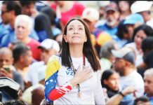 Venezuelan opposition leader Machado wins Nobel Peace Prize María Coria Machado holds one hand to her chest, as a crowd stands behind her. GETTY IMAGES