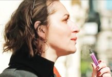 A young woman vapes. As of February this year, at least 86 million e-cigarette users were adults, mostly in high-income countries., according to the World Health Organization. GETTY IMAGES