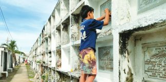 The Police Regional Office 6 reminded the public to follow local regulations and avoid bringing prohibited items while visiting cemeteries. Photo shows a boy sprucing up a tomb of a departed loved one at a public cemetery in Oton, Iloilo on October 29, ahead of the observance of All Saints’ and All Souls’ days. AJ PALCULLO/PN