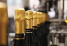 Champagne makers hope pick up in quality will put fizz back in demand Champagne bottles are filled at a champagne house, in Epernay, France on August 22, 2025. REUTERS/CHRISTIAN HARTMANN/FILE PHOTO