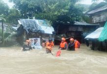 Estancia Fire Station personnel rescue stranded residents due to flooding, on Oct. 18, 2025. Data from the Provincial Disaster Risk Reduction and Management Office showed that low-lying villages in Estancia, Balasan, and Carles towns were the hardest hit. ESTANCIA FIRE STATION PHOTO