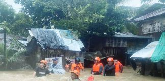 Estancia Fire Station personnel rescue stranded residents due to flooding, on Oct. 18, 2025. Data from the Provincial Disaster Risk Reduction and Management Office showed that low-lying villages in Estancia, Balasan, and Carles towns were the hardest hit. ESTANCIA FIRE STATION PHOTO