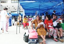 Patients wait for their turn to receive regular medical consultation outside the provincial hospital in Bogo City, Cebu on Oct. 1, 2025, at the height of a powerful 6.9 magnitude earthquake that jolted the central Philippines on Sept. 30. TED ALJIBE, AFP PHOTO