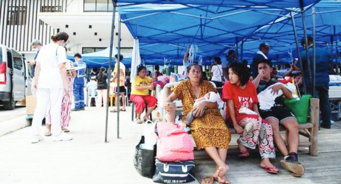 local airlines Patients wait for their turn to receive regular medical consultation outside the provincial hospital in Bogo City, Cebu on Oct. 1, 2025, at the height of a powerful 6.9 magnitude earthquake that jolted the central Philippines on Sept. 30. TED ALJIBE, AFP PHOTO