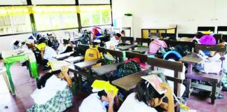 Learners from Carvasana National High School in Calinog, Iloilo perform the “duck, cover, and hold” maneuver during an earthquake drill as part of a nationwide simulation activity on September 11, 2025. CARVASANA NATIONAL HIGH SCHOOL FB PAGE PHOTO