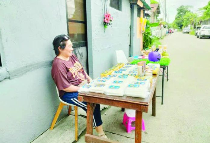 mai candle vendors “I’ve been selling here for many years. This is our livelihood,” says candle vendor Gina Garbino of Jaro, Iloilo City. “Right now, sales are still slow since it’s not yet October 31 or November 1, but we’ve already started displaying our candles in case people start buying early.” MA. THERESA LADIAO/PN