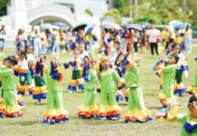 Children from various daycare centers across Iloilo City don colorful costumes as they perform a festive dance during the first-ever Citywide Early Childhood Care and Development Family Day, celebrating the vital role of families in nurturing young learners.