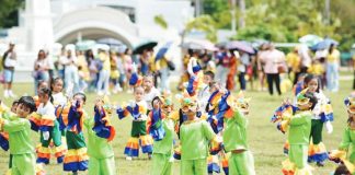 Children from various daycare centers across Iloilo City don colorful costumes as they perform a festive dance during the first-ever Citywide Early Childhood Care and Development Family Day, celebrating the vital role of families in nurturing young learners.