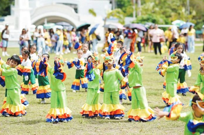 mai_family_day_copy_resized Children from various daycare centers across Iloilo City don colorful costumes as they perform a festive dance during the first-ever Citywide Early Childhood Care and Development Family Day, celebrating the vital role of families in nurturing young learners.