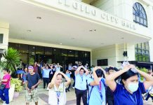Iloilo City puts earthquake readiness to the test in Western Visayas-wide drill Iloilo City Government personnel evacuate the city hall with their hands on their heads during the region-wide earthquake and tsunami drill on Thursday, October 23, 2025. The exercise simulated the “duck, cover, and hold” maneuver followed by an organized evacuation to ensure readiness in case a major seismic event strikes the region. GIL CONDES PHOTO