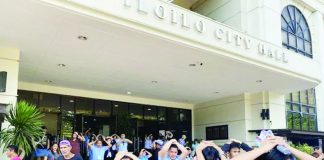 Iloilo City Government personnel evacuate the city hall with their hands on their heads during the region-wide earthquake and tsunami drill on Thursday, October 23, 2025. The exercise simulated the “duck, cover, and hold” maneuver followed by an organized evacuation to ensure readiness in case a major seismic event strikes the region. GIL CONDES PHOTO