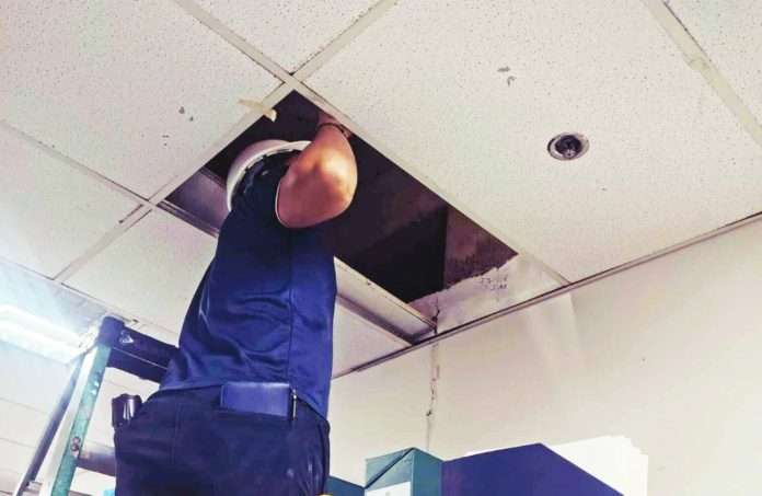 neljoy 4.4 CHECKING FOR QUAKE IMPACT. A provincial engineer examines the ceiling and internal structure of an office at the Iloilo Provincial Capitol as part of post-earthquake safety assessments ordered by Gov. Arthur Defensor Jr. after the magnitude 4.4 tremor on Oct. 15. PHOTO FROM PDRRMO ILOILO - OPERATIONS CENTER
