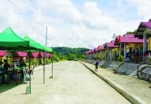ROAD TO SUSTAINABLE FUTURE. On either side of this new concrete road are rows of new, low-cost housing units built for 32 Panay Bukidnon Indigenous Peoples (IP) families in Sitio Agburi, Barangay Cahigon, Calinog, Iloilo. Displaced by the construction of the Jalaur River Multi-Purpose Project Stage II, they were relocated to Sitio Agburi by the government. NIA-6 PHOTO