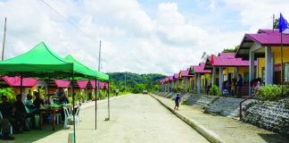 ROAD TO SUSTAINABLE FUTURE. On either side of this new concrete road are rows of new, low-cost housing units built for 32 Panay Bukidnon Indigenous Peoples (IP) families in Sitio Agburi, Barangay Cahigon, Calinog, Iloilo. Displaced by the construction of the Jalaur River Multi-Purpose Project Stage II, they were relocated to Sitio Agburi by the government. NIA-6 PHOTO