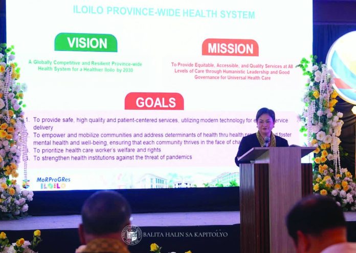 neljoy_health_summit_copy_resized_compressed Iloilo Provincial Health Officer Dr. Maria Socorro Quiñon presents the province’s vision, mission, and goals for a globally competitive and resilient province-wide health system during the 2025 Iloilo Provincial Health Summit. The summit gathered local leaders and health officials to push for the full implementation of the Universal Health Care program. PHOTO FROM BALITA HALIN SA KAPITOLYO