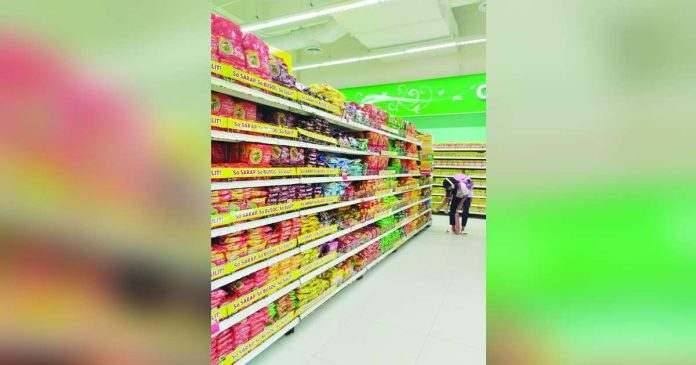 price freeze_superimposed - Copy A shopper buys basic goods at a supermarket in Pavia, Iloilo on Tuesday, October 28, 2025. PN PHOTO