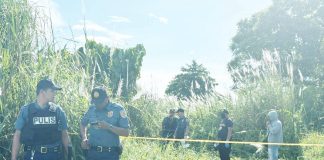 Police investigators at the crime scene in Barangay 12, Bacolod City, where the body of 17-year-old Freya Go was discovered on October 22, 2025. Authorities have launched a special task group to pursue those responsible for her death. RMN DYHB BACOLOD 747 FB PHOTO