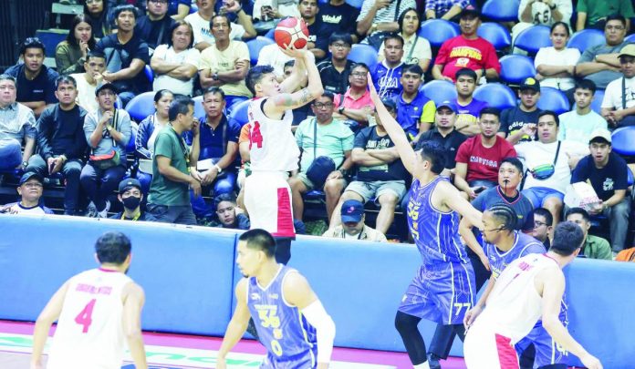 Barangay Ginebra San Miguel Kings’ Sonny Estil pulls up for a shot against the defense of TNT Tropang Giga’s Kevin Ferrer. PBA PHOTO