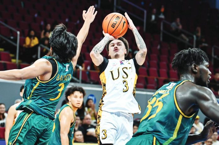 sports UST UST Growling Tigers’ Kyle Paranada pulls up for a jumper against FEU Tamaraws’ Jorick Bautista during their UAAP Season 88 clash at the Mall of Asia Arena. UAAP PHOTO